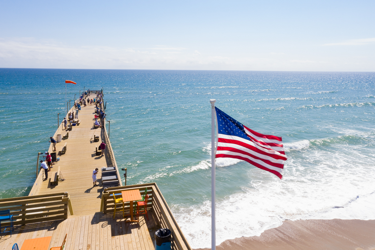 American flag flying high at Avalon Pier